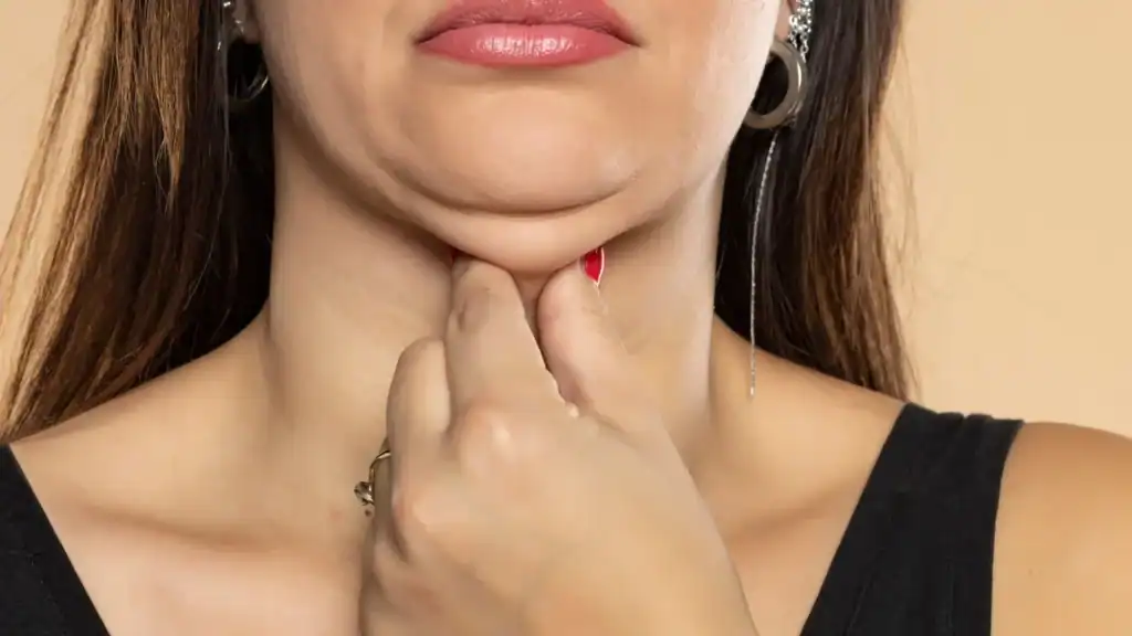 An image of a woman with double chin, sad, worried : Non Surgical Double Chin Removal Treatment in Whitnash, UK